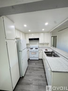 Azusa apartment for rent - A large outdoor swimming pool with a house in the background.