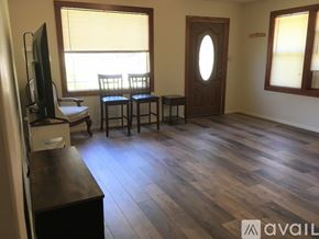 Gold Hill house for rent - A living room with a wooden floor and a television.