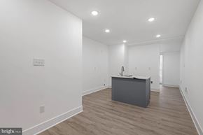 Baltimore house for rent - A room with a desk and a white wall.