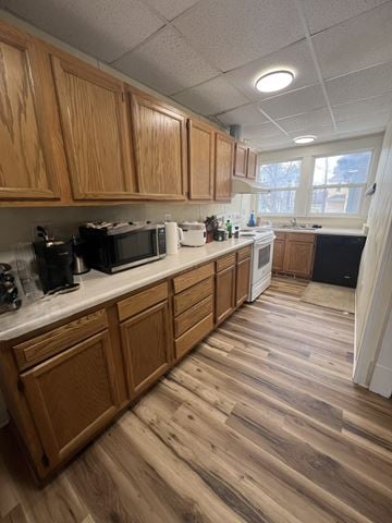 Grinnell apartment for rent - A kitchen with wooden cabinets and a white counter.