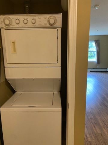 Edmonton apartment for rent - A white dishwasher is sitting in a kitchen.