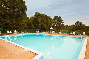 Somerset apartment for rent - a large swimming pool with chairs around it