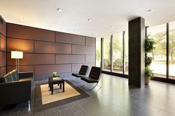 Somerset apartment for rent - a living room with two black chairs and a table