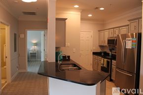 Charleston apartment for rent - A kitchen with a black counter top and stainless steel appliances.