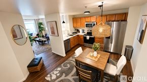 Appleton apartment for rent - A kitchen with wooden cabinets and a black countertop.