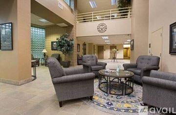 Appleton apartment for rent - A living room with grey chairs and a coffee table.