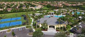 Naples house for rent - A large building with a pool in front of it.