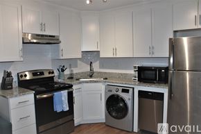 Charleston apartment for rent - A kitchen with white cabinets and stainless steel appliances.