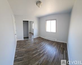 La Crosse apartment for rent - A bathroom with a toilet, sink, and bathtub.