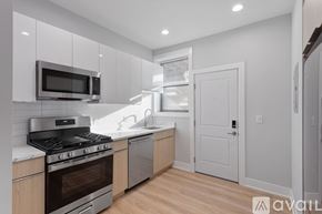Chicago apartment for rent - A kitchen with a stove, oven, and microwave.