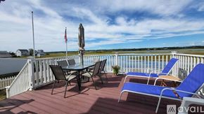 Wells house for rent - A deck with chairs and a table is available for rent.