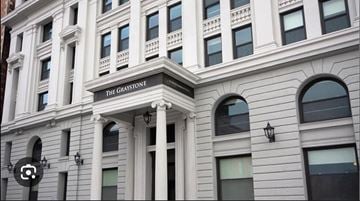 Buffalo apartment for rent - The building is called The Graystone and has a lot of windows.