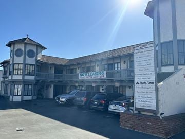 La Mirada apartment for rent - A sunny day at the Statewide Financial Services building with cars parked in front.