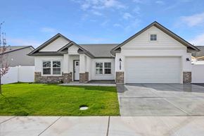 Twin Falls house for rent - A two-story house with a garage and a driveway.