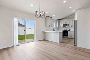Twin Falls house for rent - A modern kitchen with a sliding glass door leading to a backyard.