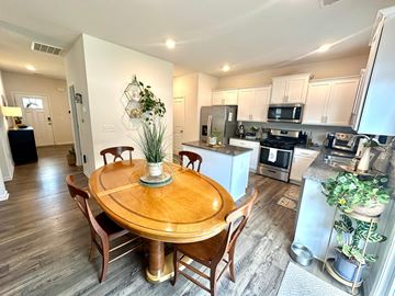 Piedmont house for rent - A kitchen with a table and chairs in the middle of the room.