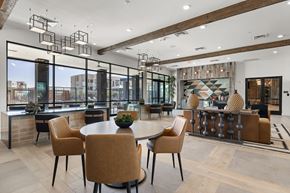 Phoenix apartment for rent - A modern dining room with a round table and chairs.