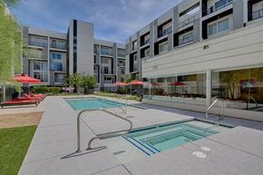 Las Vegas apartment for rent - a swimming pool in front of an apartment building