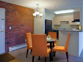 Weymouth apartment for rent - a dining room with a table and chairs