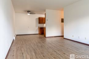 Madison apartment for rent - A room with wooden flooring and a ceiling fan.