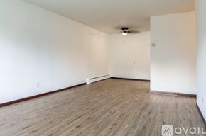 Madison apartment for rent - A room with wooden flooring and white walls.