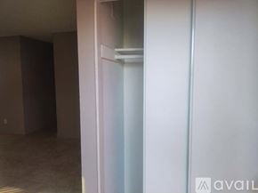 Fullerton apartment for rent - A room with a white door and a brown wall.