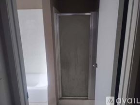 Fullerton apartment for rent - A closed door in a room with a white wall.