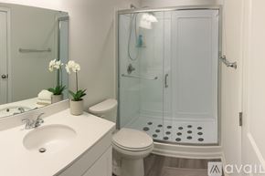 Summerville house for rent - A bathroom with a toilet, sink, and shower.