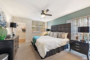 Miami Lakes apartment for rent - a bedroom with a large bed and a ceiling fan
