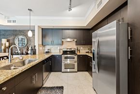 Miami Lakes apartment for rent - a kitchen with stainless steel appliances and granite counter tops