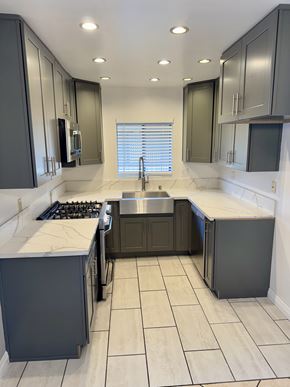 Glendale apartment for rent - A kitchen with a sink, stove, and cabinets.