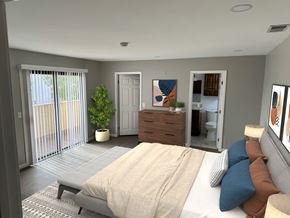 Glendale apartment for rent - A bedroom with a bed, dresser, and sliding glass doors.