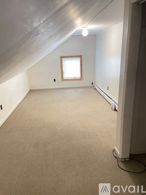Poultney apartment for rent - A room with a window and a carpeted floor.