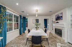 Spring house for rent - A dining room with a table set for four.
