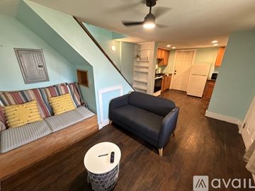 Columbus house for rent - A living room with a couch and a staircase.