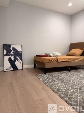 Los Angeles townhouse for rent - A modern kitchen with white cabinets and stainless steel appliances.