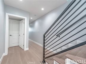 Los Angeles townhouse for rent - A staircase with a metal railing and wooden steps.
