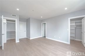 Los Angeles townhouse for rent - A white bathroom with a sink, mirror, and a door leading to a balcony.