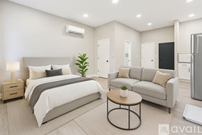 Baltimore apartment for rent - A kitchen with white cabinets and stainless steel appliances.
