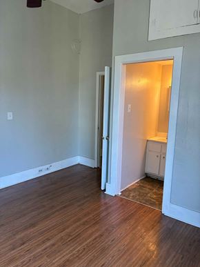 Mobile house for rent - A room with a white door leading to another room.