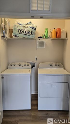 Charlotte apartment for rent - A kitchen with a table and chairs in the middle of the room.
