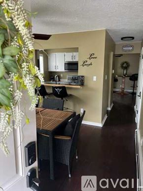 Cody house for rent - A dining room with a table and chairs is shown.