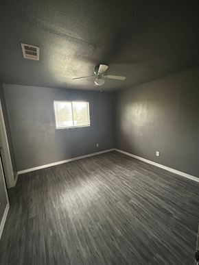 Killeen apartment for rent - A room with a ceiling fan and a window.