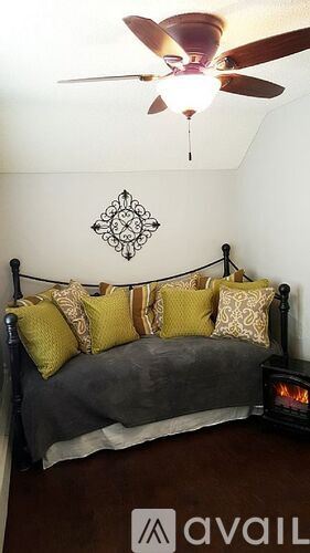 Cody house for rent - A bedroom with a bed and a ceiling fan.