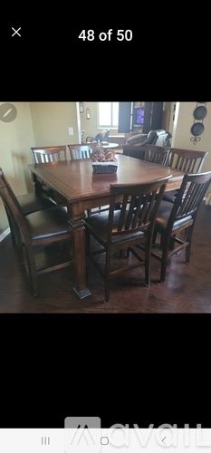 Cody house for rent - A dining room with a wooden table and chairs.