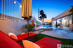 Lake Havasu City house for rent - A patio with a pool and a couch.