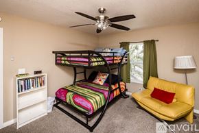 Lake Havasu City house for rent - A bedroom with a bunk bed and a yellow couch.
