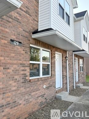 Bowling Green apartment for rent - A house numbered 129 with a white door and windows.