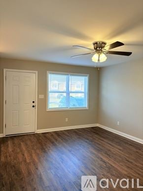 Bowling Green apartment for rent - A room with a ceiling fan and a window.