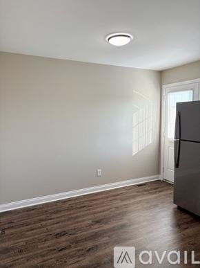 Bowling Green apartment for rent - A kitchen with a refrigerator and wooden flooring.